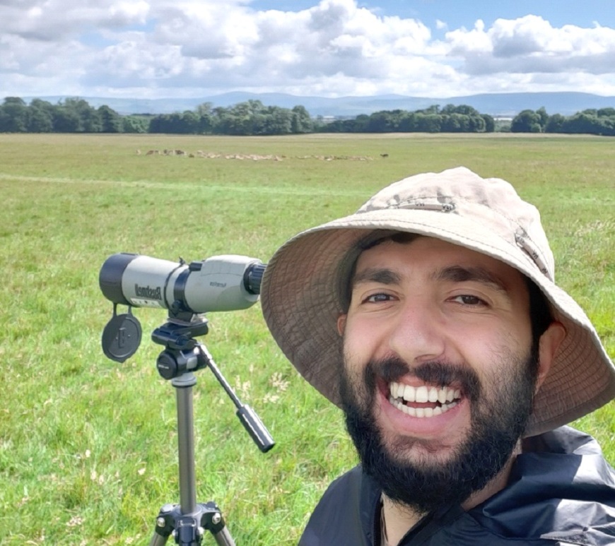 Bawan Amin in the field with a telescope tracked on fallow deer
